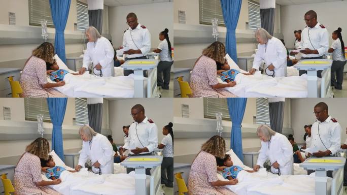 友好的资深女儿科医生在病房里照顾孩子和母亲，由不同的男护士小组协助