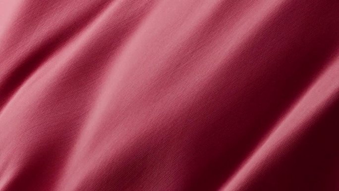 特写波浪红色丝绸面料飘动的表面与织物细节
