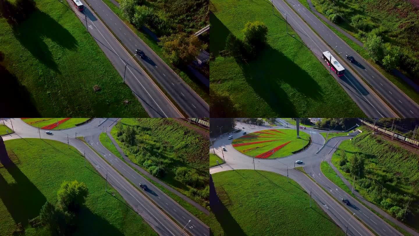 公园附近道路上车辆的移动。夹。道路上的汽车在不同的方向上行驶，高楼大厦随处可见。