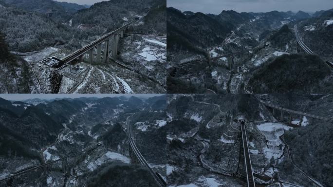 航拍雪中沪昆高铁复兴号动车穿过贵州大山