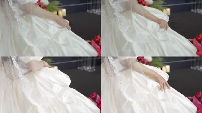 新娘抚摸自己的婚纱广告