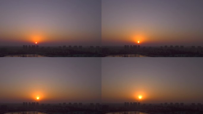 黎明城市天际线日出东方希望太阳升早晨雾霾