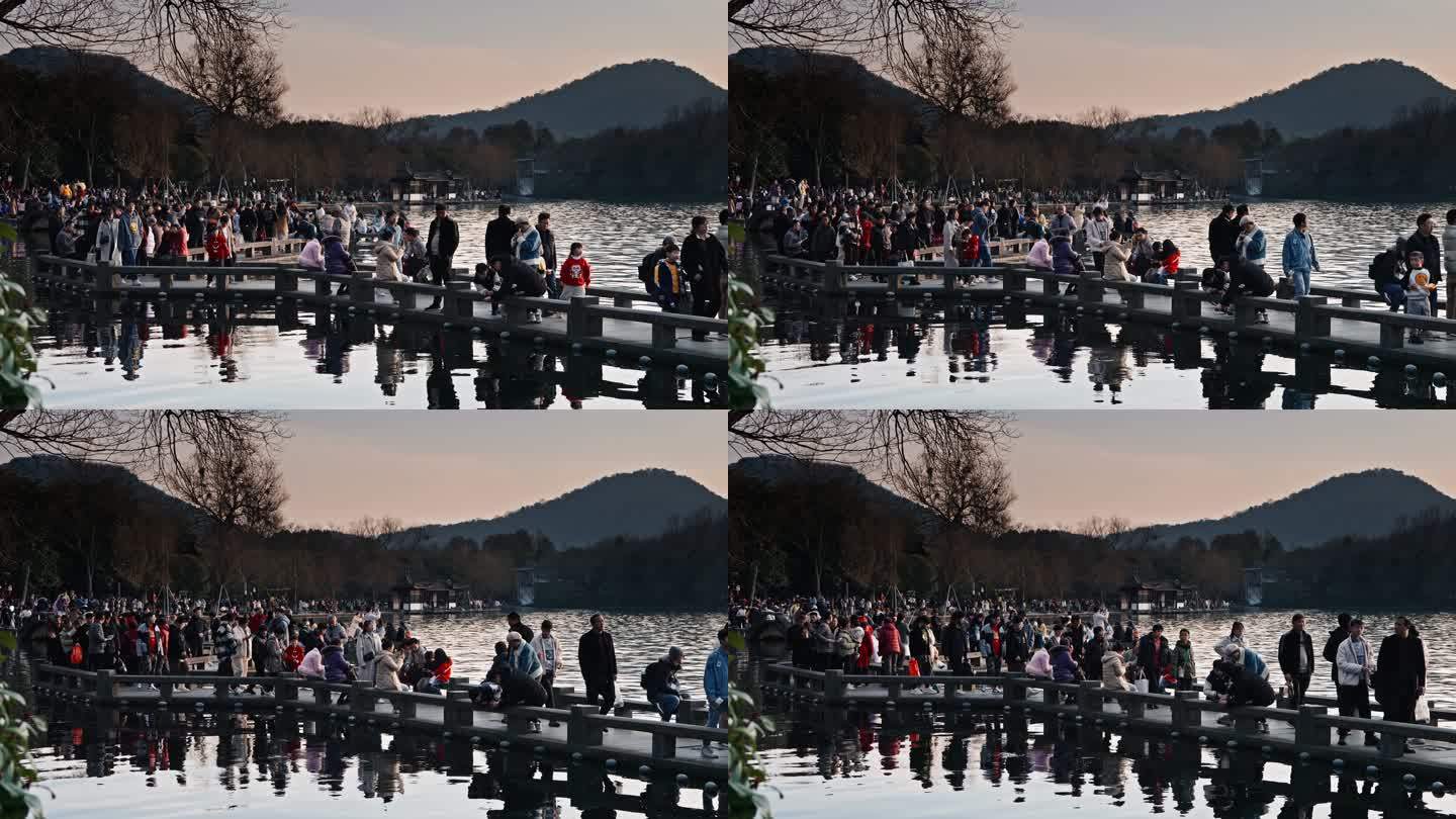 冬日正月里西湖长桥的人来人往