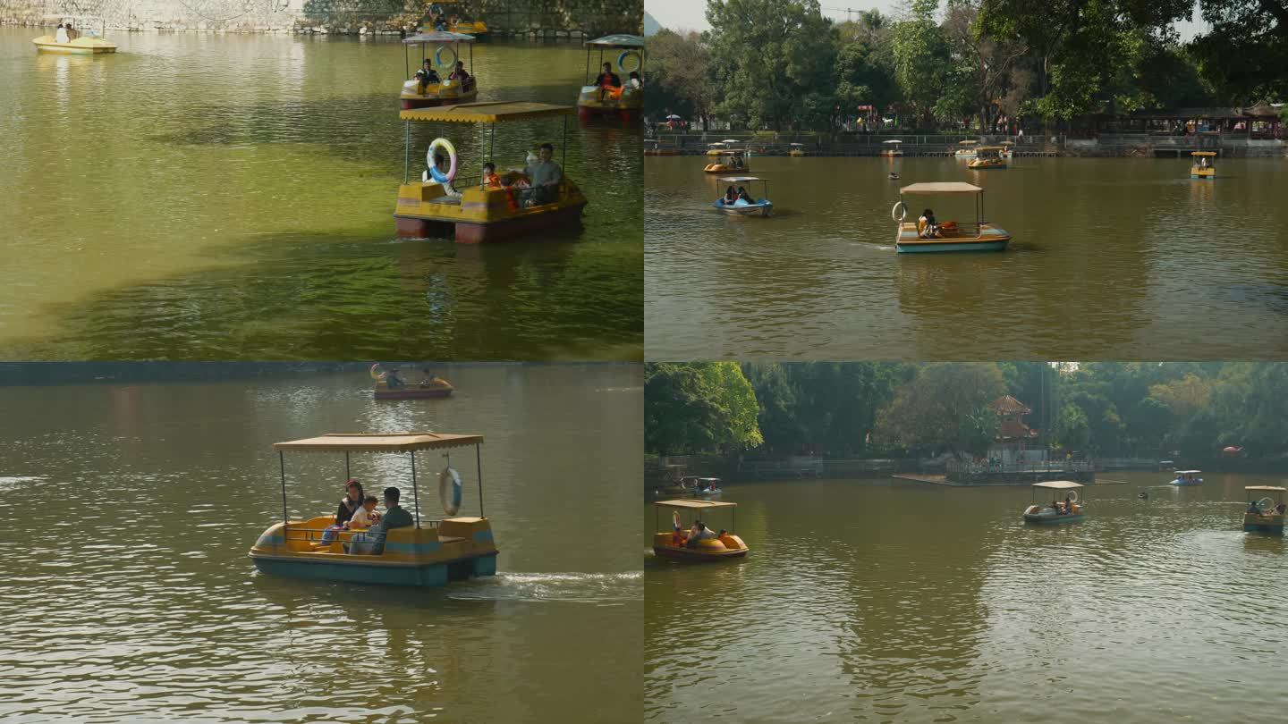 公园里游客划游艇