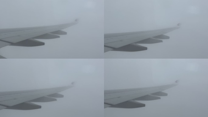 飞机机翼穿过云雾