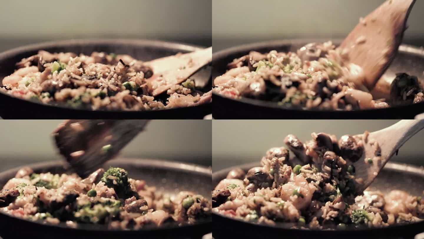 用黑锅炒西兰花、虾、青豆和米饭的近照