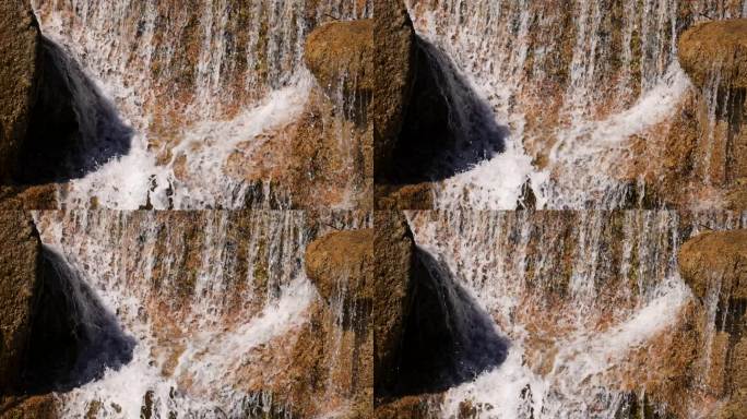 慢镜头升格户外瀑布水花冲击岩石