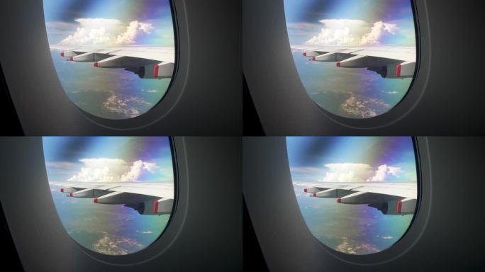 从飞行中的客机窗口向外望去，可以看到广阔的天空全景，汹涌的云层一直延伸到眼睛所能看到的地方，旅行和航