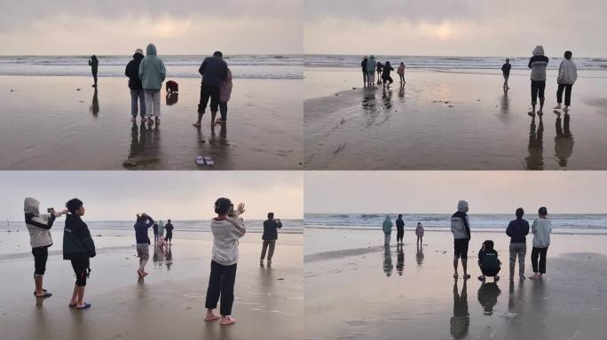 大海沙滩日出倒影海边赶海拾贝休闲散步人群
