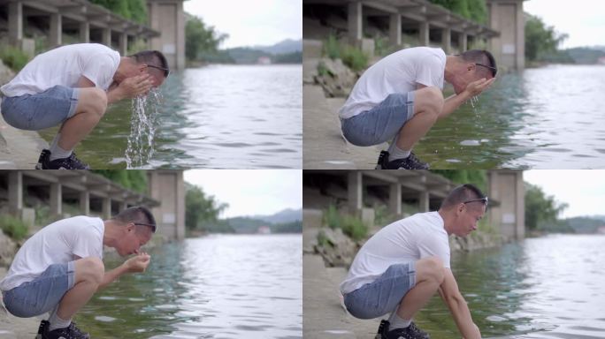 立夏 实拍男子清澈见底的河边洗脸洗手