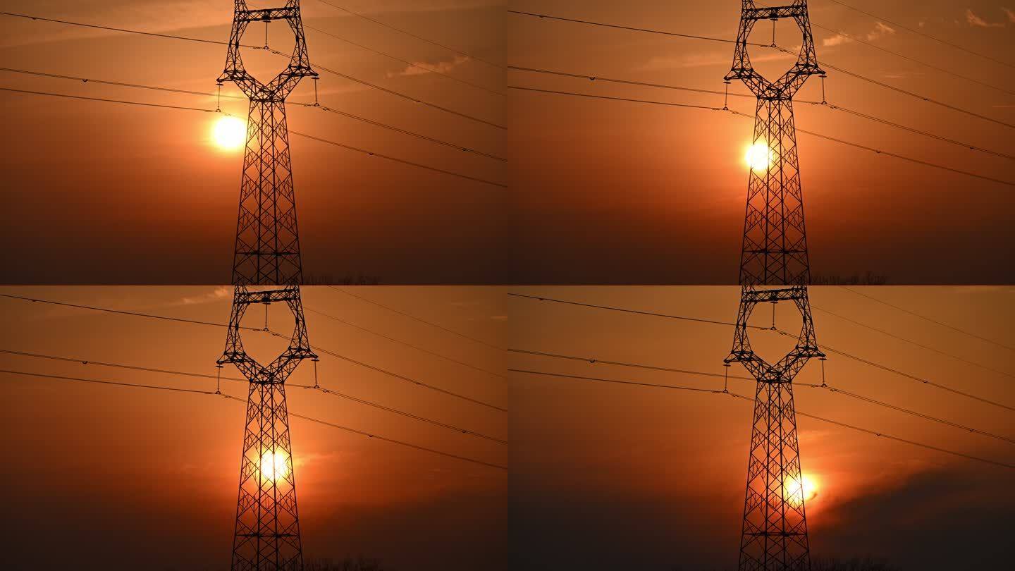 夕阳从输电铁塔旁落下的延时风景
