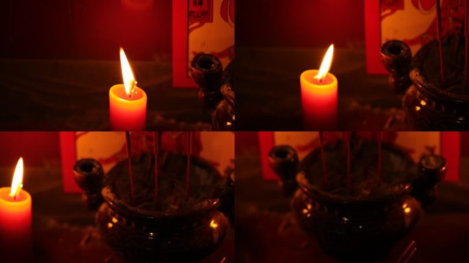 神龛前燃烧的香烛上供祈福求神拜佛