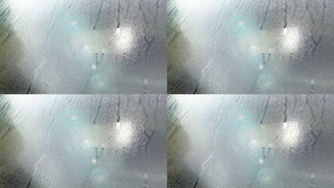 凝露玻璃汽车水湿挡风玻璃窗雨雨雾潮湿车辆滴湿雾透明光特写视频清流凝析气候潮湿滴运动特写滴