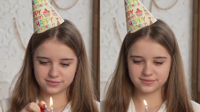 竖屏:生日女孩在工作室里吹灭蛋糕上的蜡烛，背景是一个气球。一个快乐的女人庆祝一个特殊的日子或事件的脸