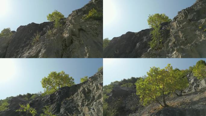欧洲夏日岩石悬崖的空中升降和平移拍摄