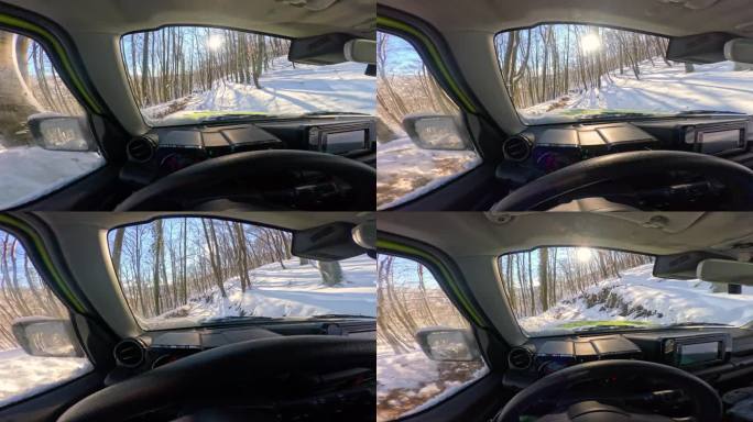 POV:在美丽的阳光明媚的冬天驾驶越野车穿过白雪皑皑的森林