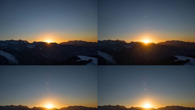 达瓦更扎日出延时摄影太阳从雪山背后升起