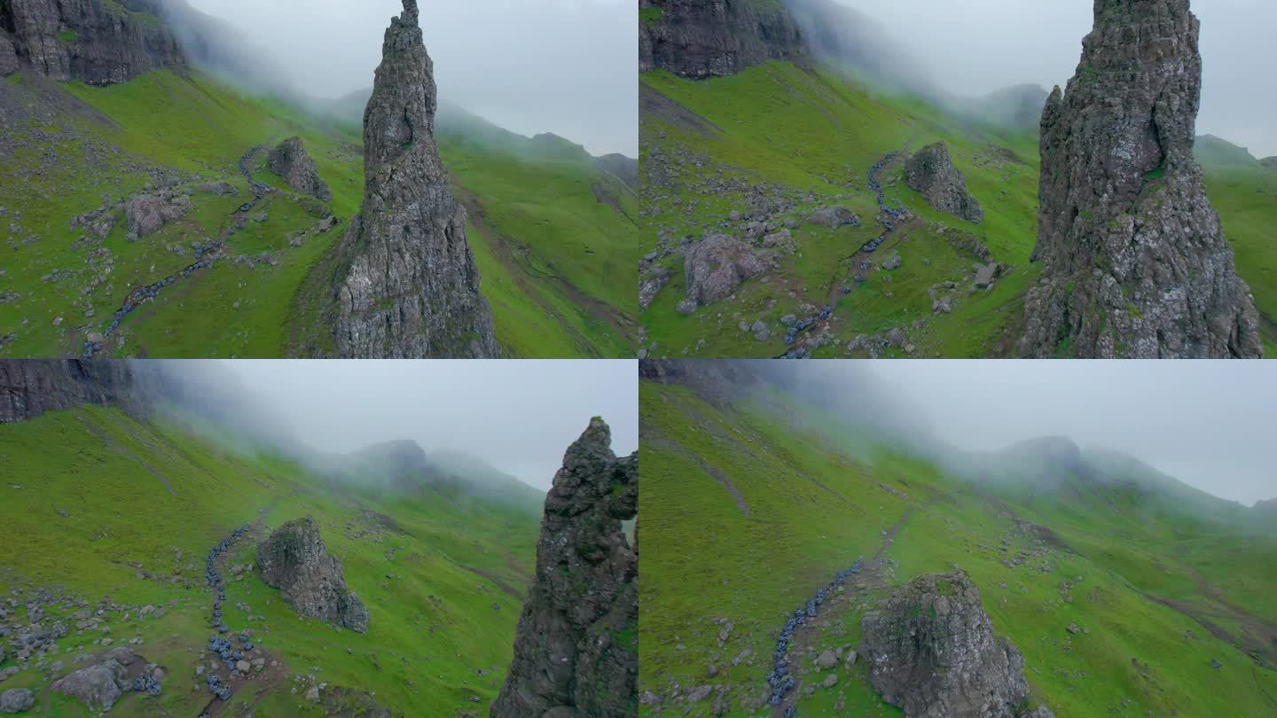 航拍:飞过令人惊叹的玄武岩构造，飞向山脊上的薄雾