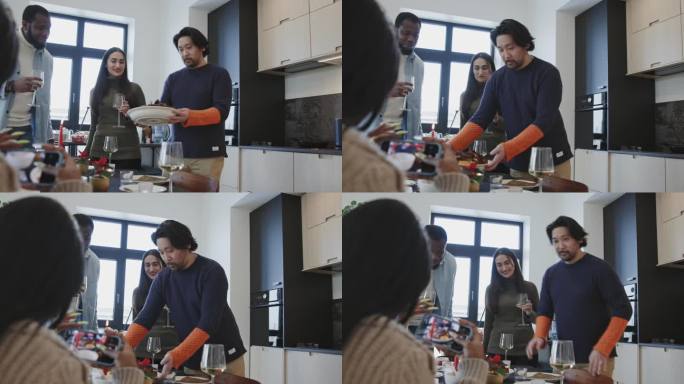 一名日本男子将圣诞烤肉放在桌子上，他的朋友为社交媒体拍摄了视频