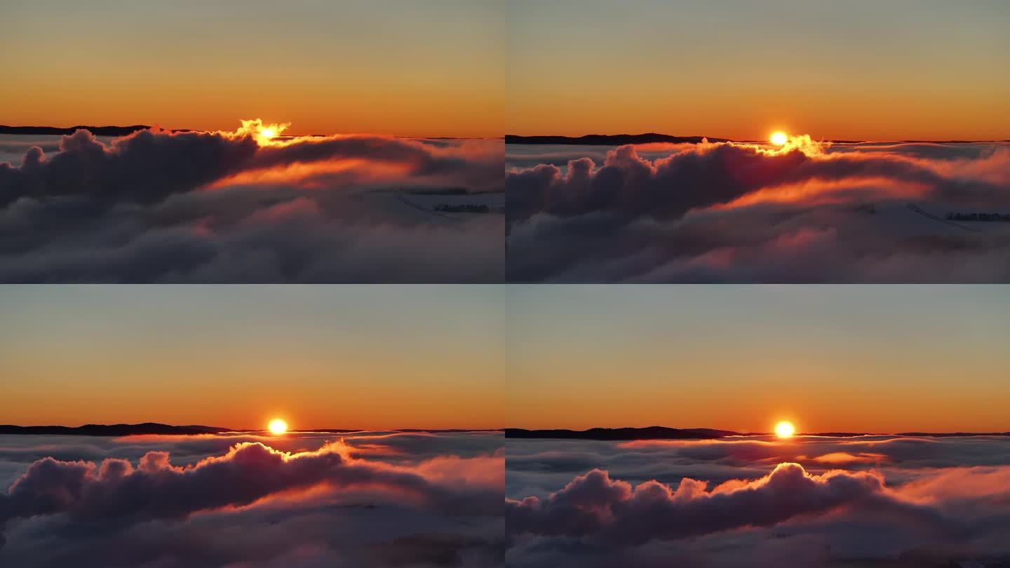 史诗级云景的航拍镜头，在日落时，在炽热的太阳前慢慢漂浮