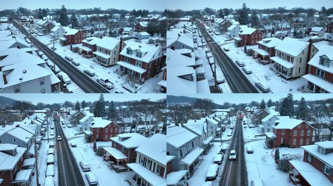 白雪覆盖的街道上有古色古香的雪屋。冬季美国城镇的空中飞行。东北部居民区降雪。