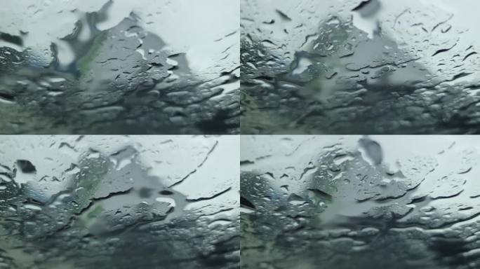 从车内看到雨滴打在车窗上