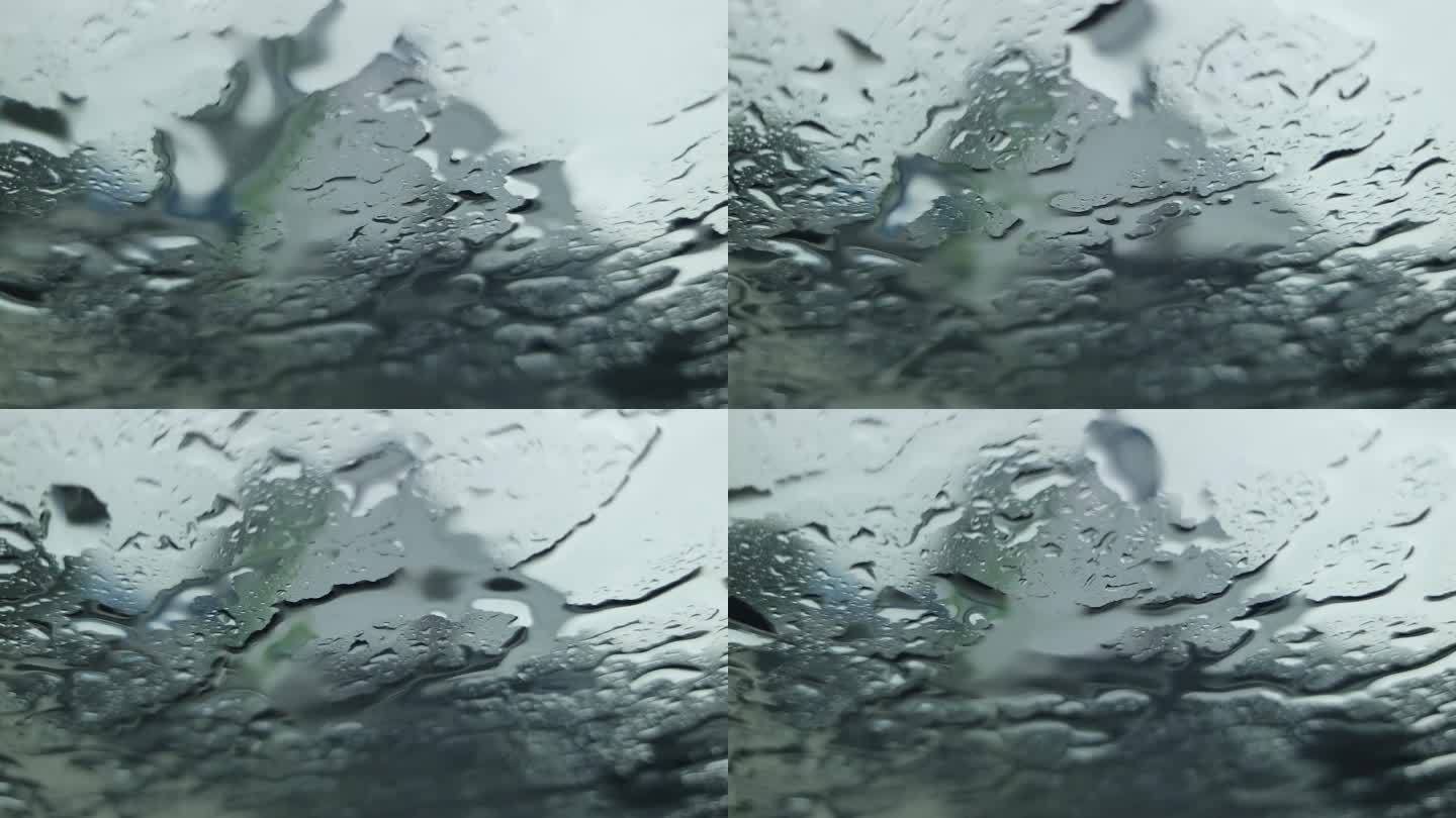 从车内看到雨滴打在车窗上