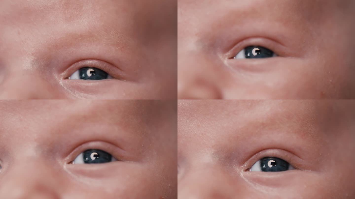 可爱的蓝眼睛男婴望向别处的全画幅特写镜头