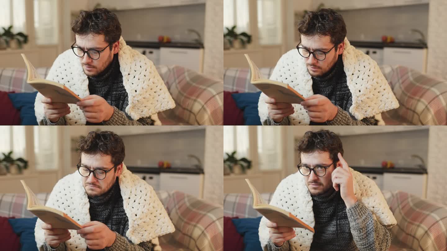 戴眼镜的男人看书，睁大眼睛，表达惊奇