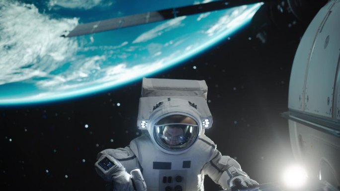 宇航员在远离地球的外太空执行舱外任务。勇敢的人在空间站外用螺旋枪固定和调整太阳能电池板模块的角度