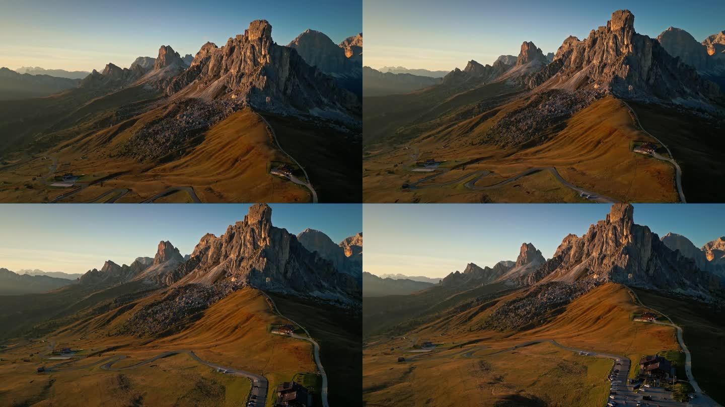 日落时分的Giau山口的4K鸟瞰图，这是意大利多洛米蒂山脉最著名的山口之一，