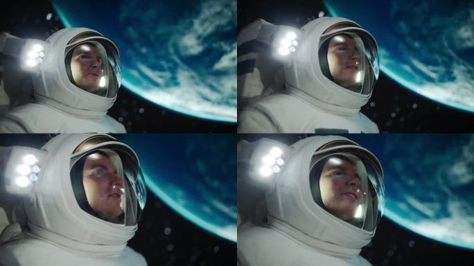 一个帅哥在国际空间站第一次太空行走的照片。年轻的宇航员与队友交流，兴奋地从外太空看到地球