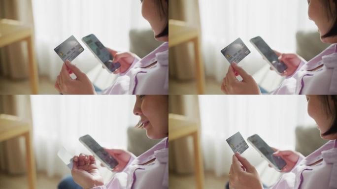 女子用信用卡在智能手机上网购