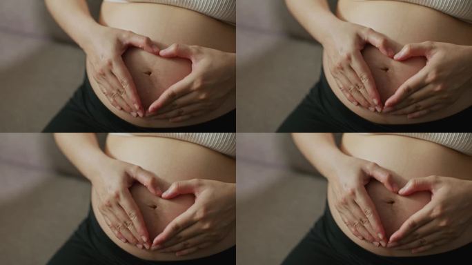 特写镜头:孕妇用手捂住肚子
