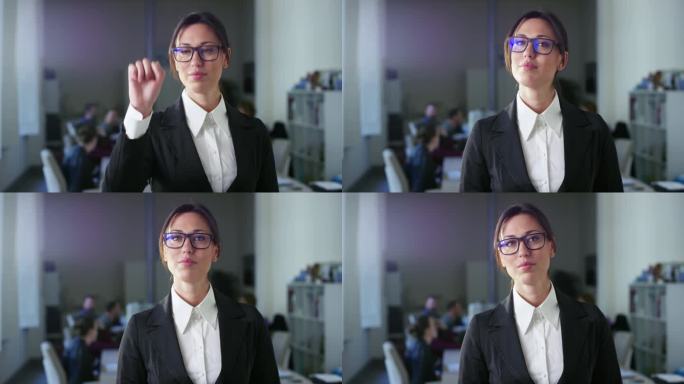 在现代商务办公室，美丽自信的女人做虚拟现实激活触摸手势。模型增强现实拍摄。使用科技的女性企业CEO的