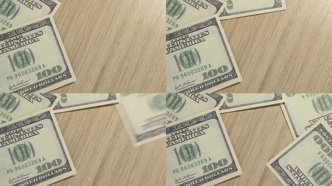 镜头的钱，钞票，木制书桌背景