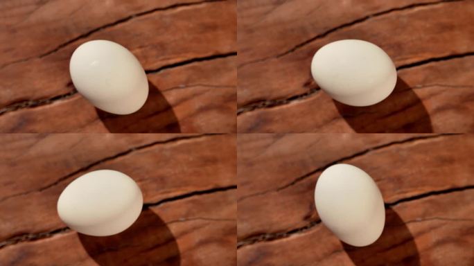 鸡蛋在木板上转圈
