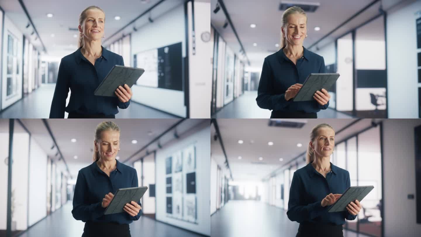 成年女商人微笑着在数码平板电脑上查看财务文件。一个成功的女企业经理漫步在宽敞的现代办公大楼里的肖像