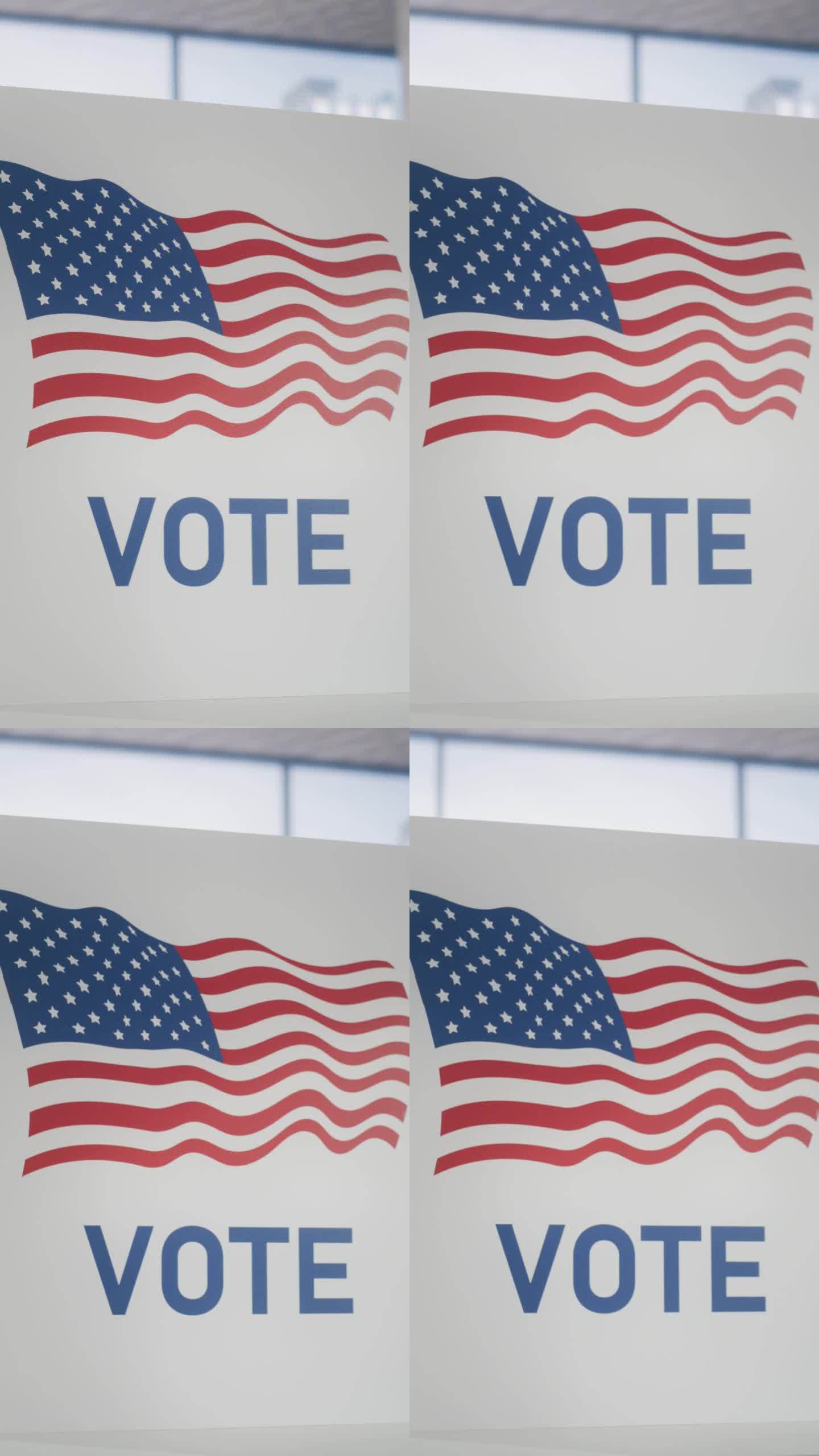 垂直屏幕:在金融区一个空的投票站的投票亭上建立美国国旗的镜头。选举日概念与爱国美利坚合众国的视觉效果