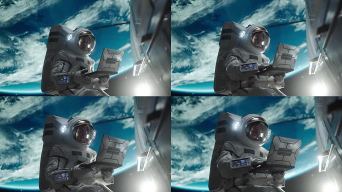 一个年轻的宇航员在外太空失重漂浮的肖像。宇航员在轨道飞船外用笔记本电脑工作。男子正在上网，正在连接卫