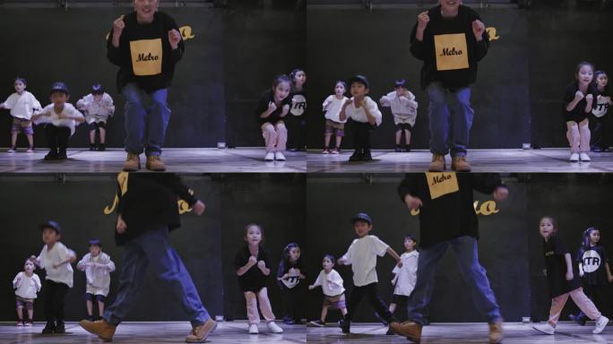 日本的孩子们在舞蹈室里和他们的老师跳舞