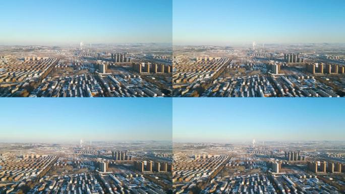 中国山东省淄博市的冬季日落，以发电厂的剪影为背景，呈现出迷人的景色。
