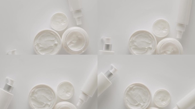 化妆品和美容用品的瓶瓶罐罐在白色的背景上旋转。