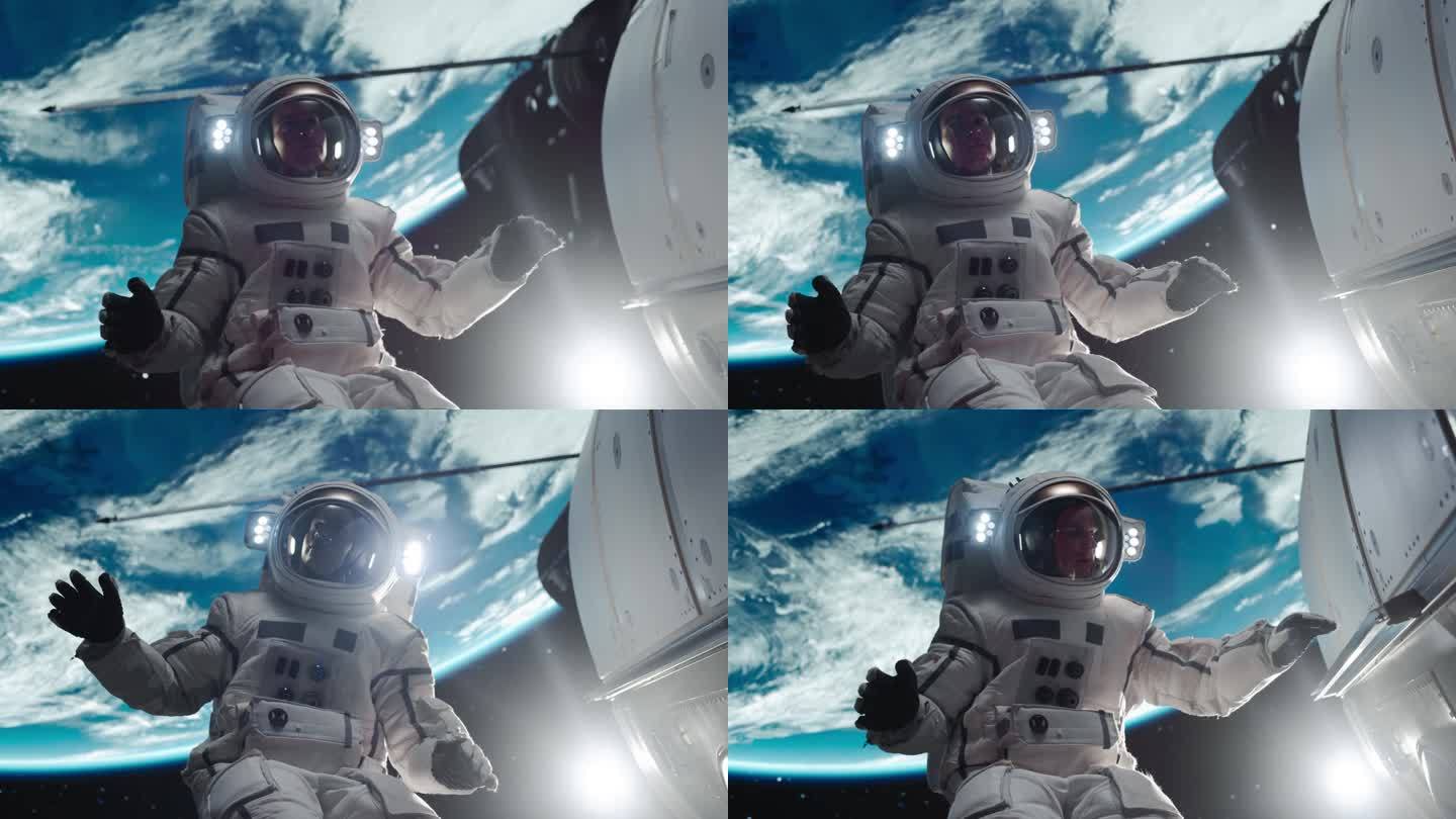 一个勇敢的宇航员漂浮在宇宙飞船外的肖像。在太空中工作的专业宇航员，在他的高级宇航服中为相机摆姿势，在