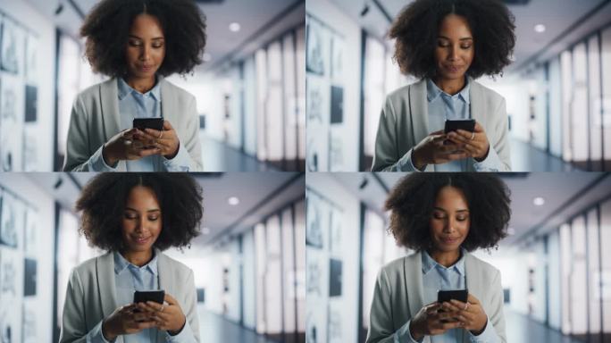 快乐的黑人女孩用手机在社交媒体上给人们发信息。近距离对焦从手切换到脸。时尚的年轻女性与朋友和商业伙伴
