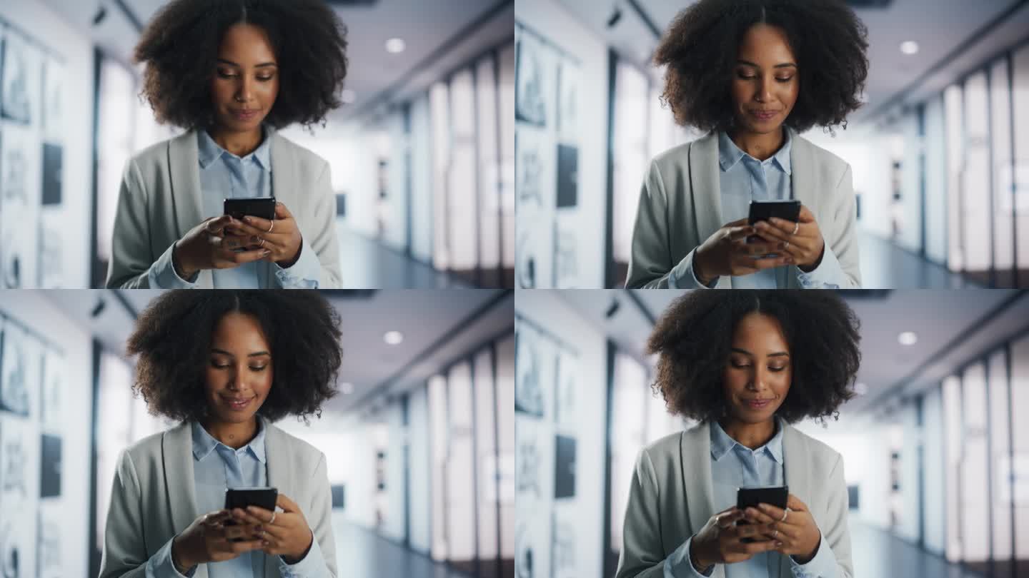 快乐的黑人女孩用手机在社交媒体上给人们发信息。近距离对焦从手切换到脸。时尚的年轻女性与朋友和商业伙伴
