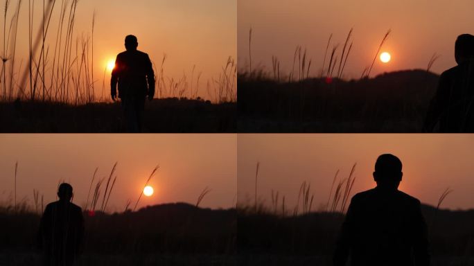 夕阳下的男人走在山上