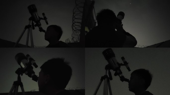 男孩用望远镜观望天空