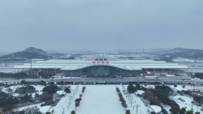 航拍雪中徐州东高铁站唯美城市宣传片