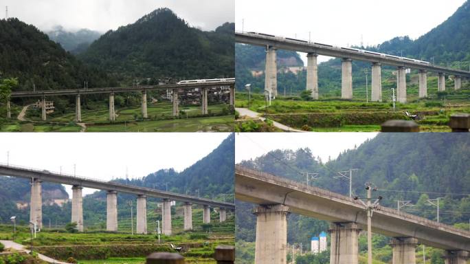 贵州省 台江县 高铁从村庄的高架桥上驶过